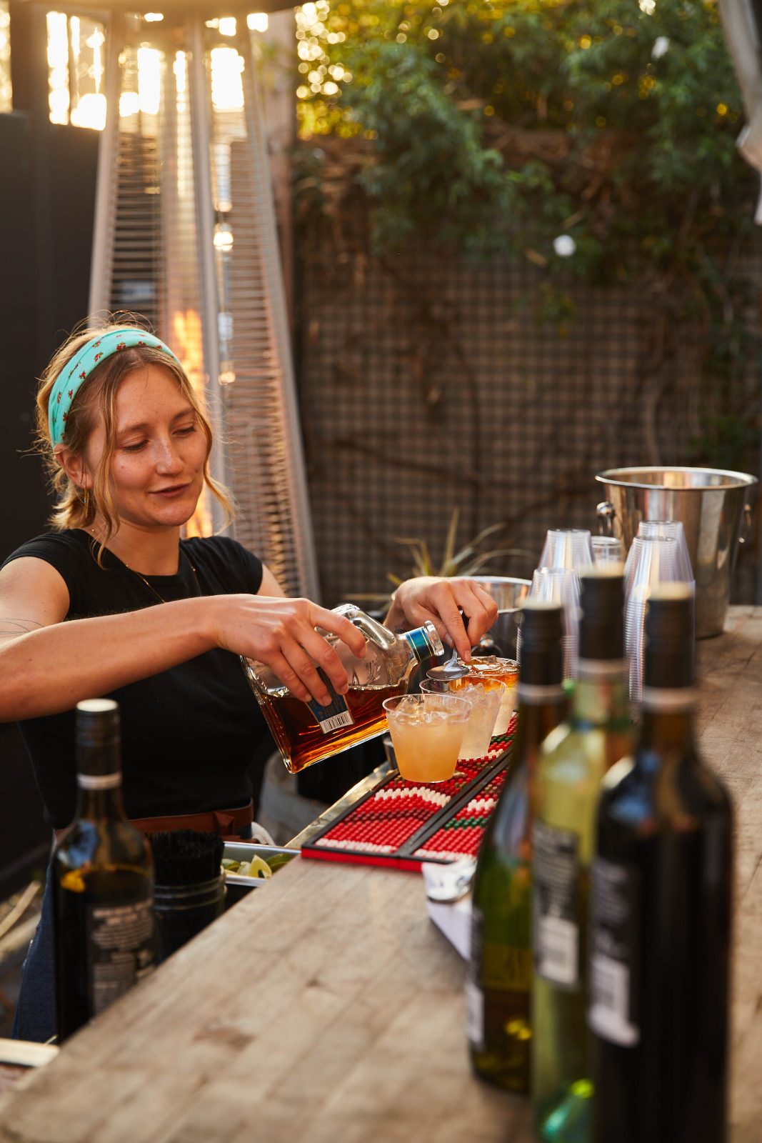 Bartender pouring drinks at the launch