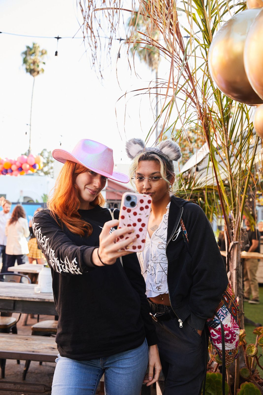 Guests taking a selfie in NT merch