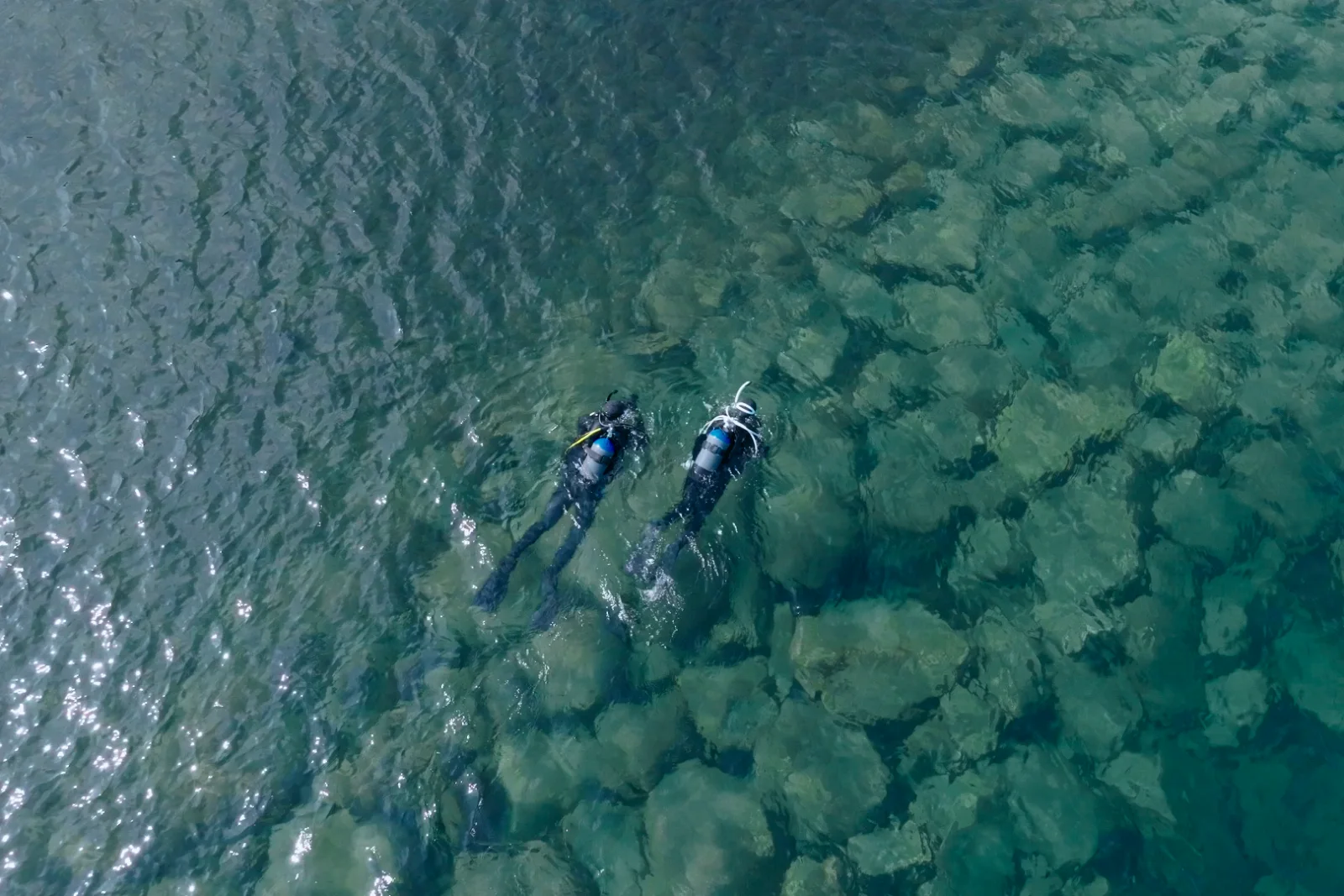 Divers seen from above in clear water, Izu