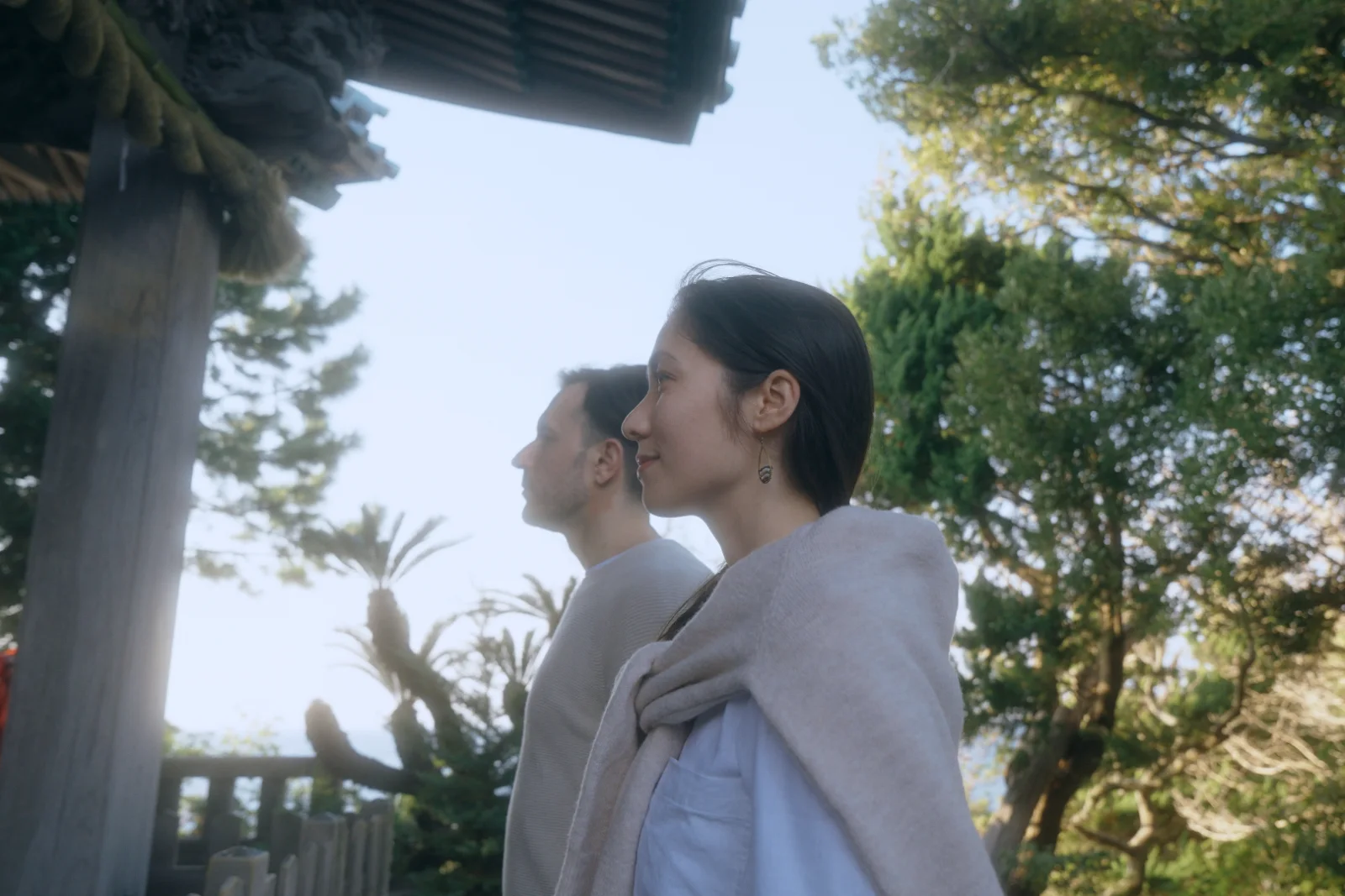 Couple at a coastal shrine gate